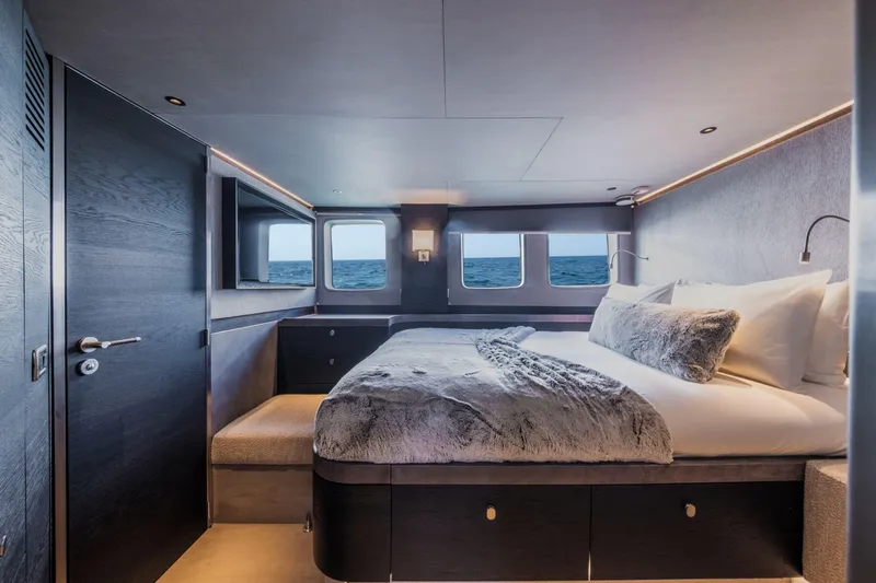 Loloma Yacht Photos Pics Luxurious bedroom interior of 2025 Zeelander 7 yacht with ocean view windows.