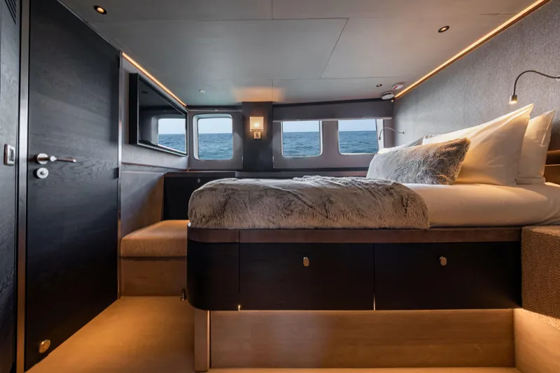 Loloma Yacht Photos Pics Luxurious bedroom interior of 2025 Zeelander 7 yacht with ocean view windows.