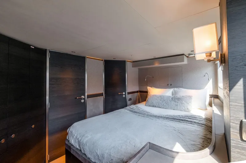 Loloma Yacht Photos Pics Luxurious bedroom interior of 2025 Zeelander 7 yacht, featuring modern design and cozy bedding.