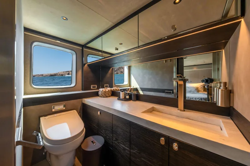 Loloma Yacht Photos Pics Luxurious bathroom interior of 2025 Zeelander 7 yacht with ocean view windows.