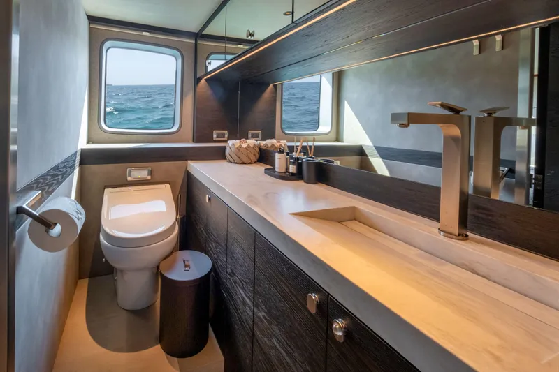 Loloma Yacht Photos Pics Luxurious bathroom interior of 2025 Zeelander 7 yacht with ocean view windows.
