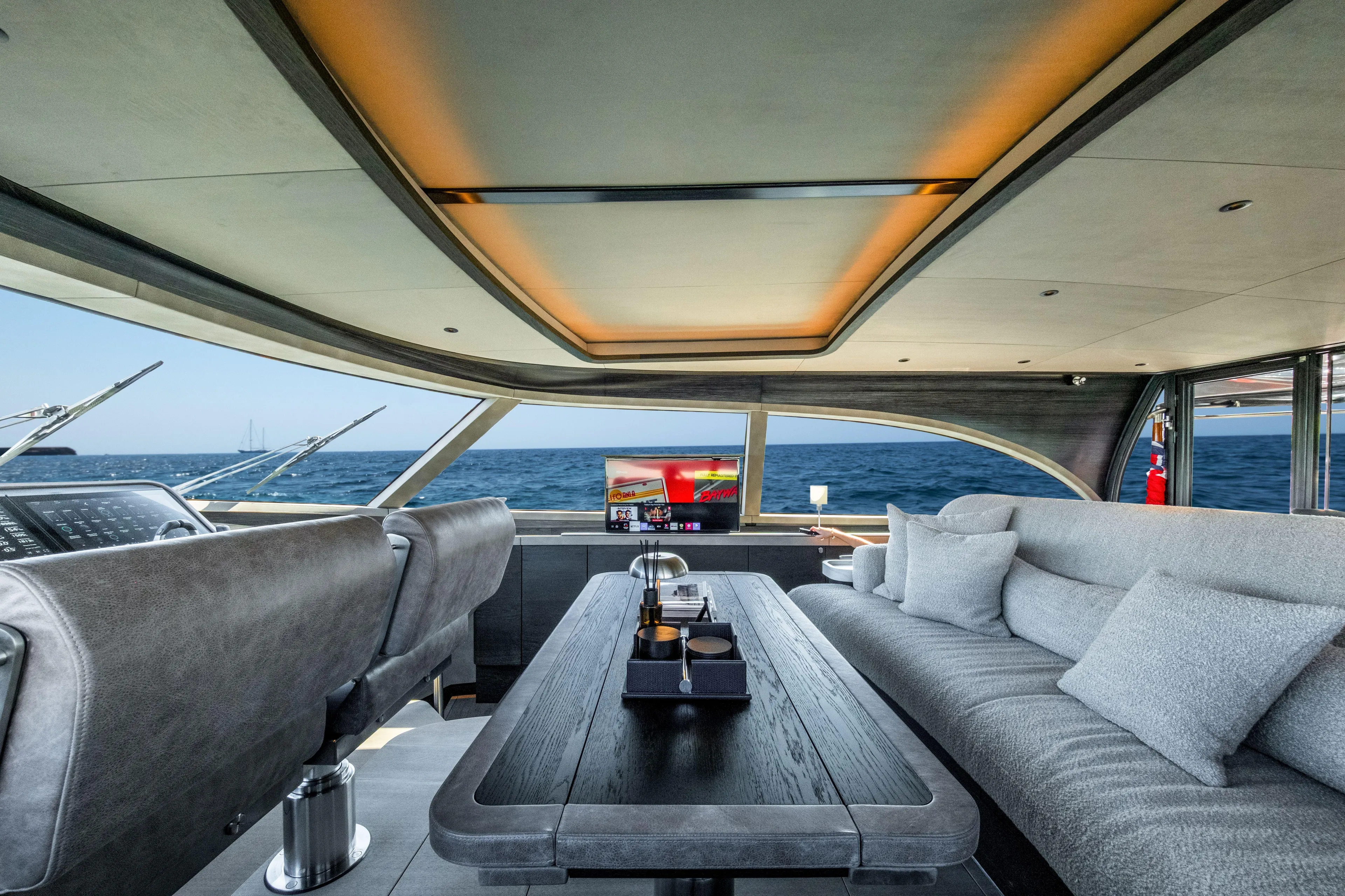 Loloma Yacht Photos Pics Luxurious interior of 2025 Zeelander 7 yacht with ocean view and modern furnishings.