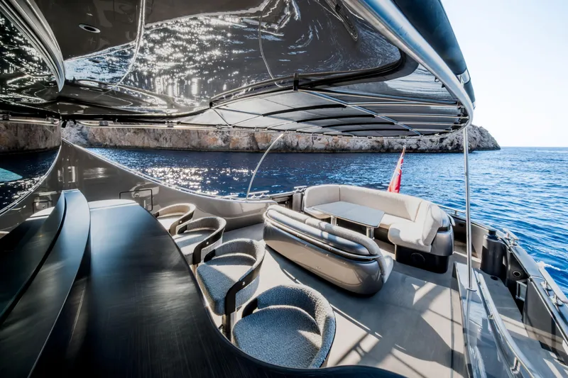 Loloma Yacht Photos Pics Luxurious 2025 Zeelander 7 yacht interior with elegant seating, overlooking serene blue waters.