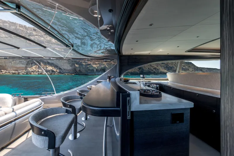 Loloma Yacht Photos Pics Luxurious interior of 2025 Zeelander 7 yacht with ocean view and elegant bar area.