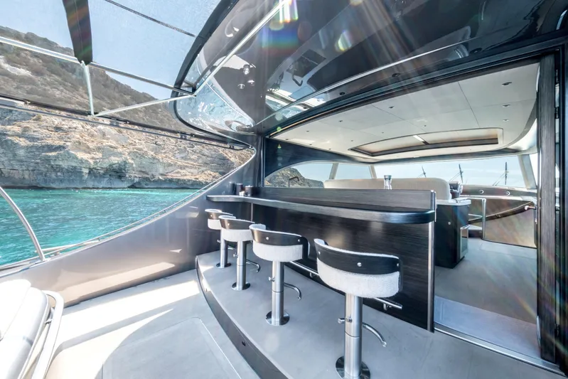 Loloma Yacht Photos Pics Luxurious interior of 2025 Zeelander 7 yacht with bar stools and scenic ocean view.