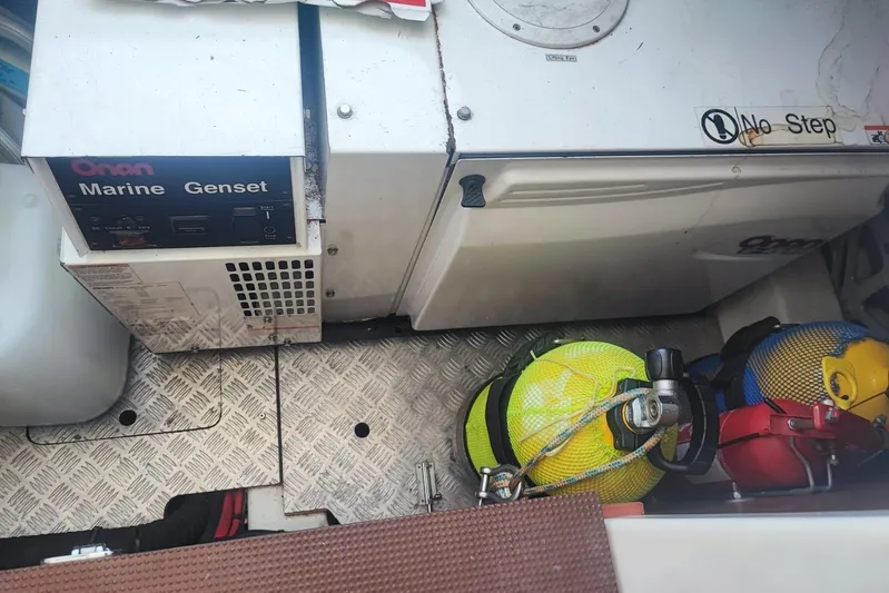  Yacht Photos Pics Onan marine generator in a 2007 Prestige 46 boat, with safety equipment nearby.