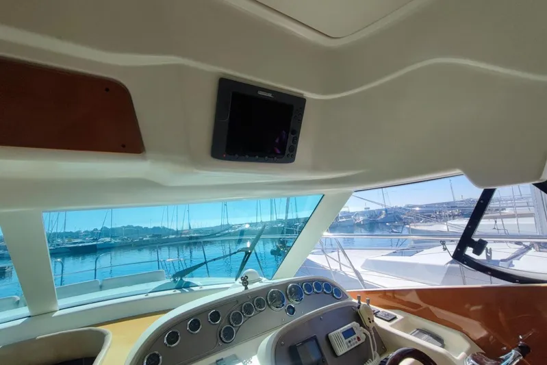  Yacht Photos Pics Interior view of 2007 Prestige 46 yacht cockpit with marina in background.