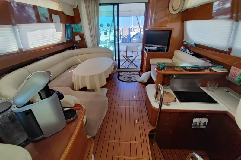  Yacht Photos Pics Luxurious interior of a 2007 Prestige 46 yacht with elegant seating and modern amenities.