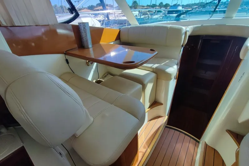  Yacht Photos Pics Luxurious interior of a 2007 Prestige 46 yacht with elegant seating and wooden accents.
