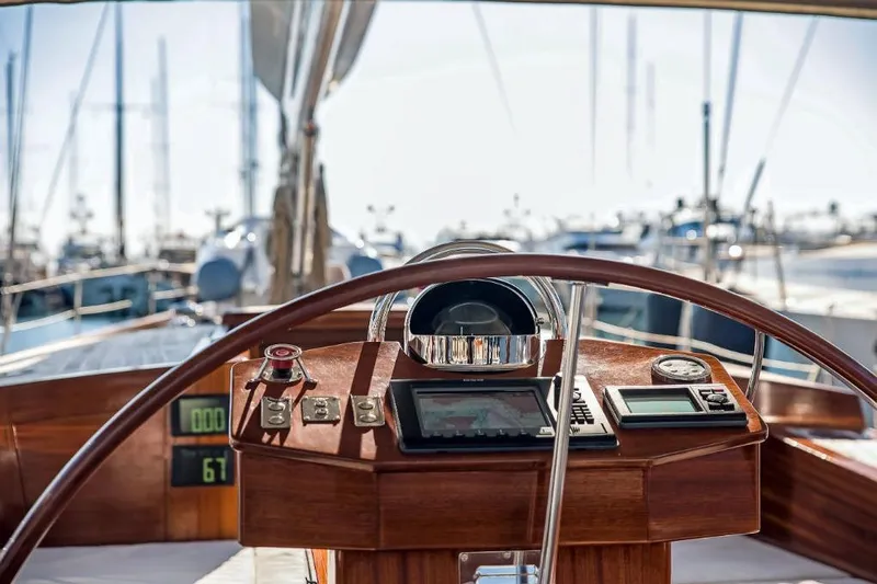 Spirit R74 Yacht Photos Pics Cockpit view of 2014 Spirit R74 yacht with navigation instruments and wooden steering wheel.