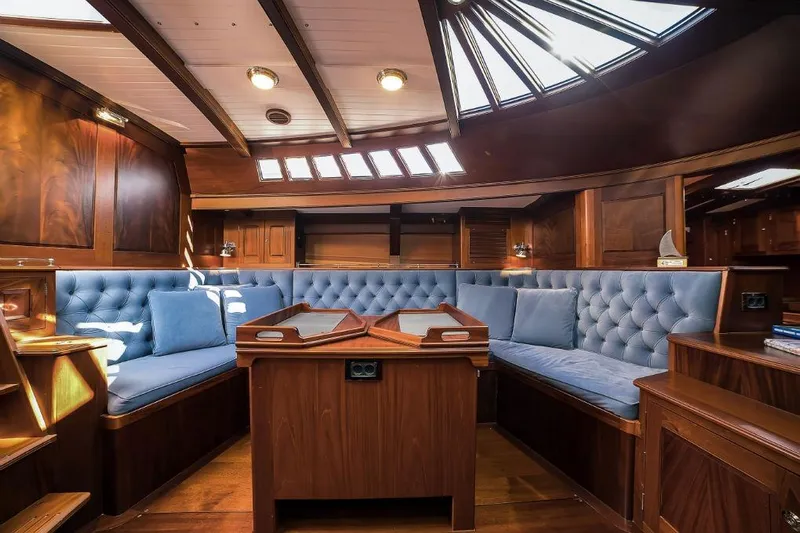 Spirit R74 Yacht Photos Pics Luxurious interior of 2014 Spirit R74 yacht with elegant wood and blue upholstery.