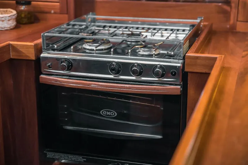 Spirit R74 Yacht Photos Pics 2014 Spirit R74 stove with oven in a wooden kitchen setting.