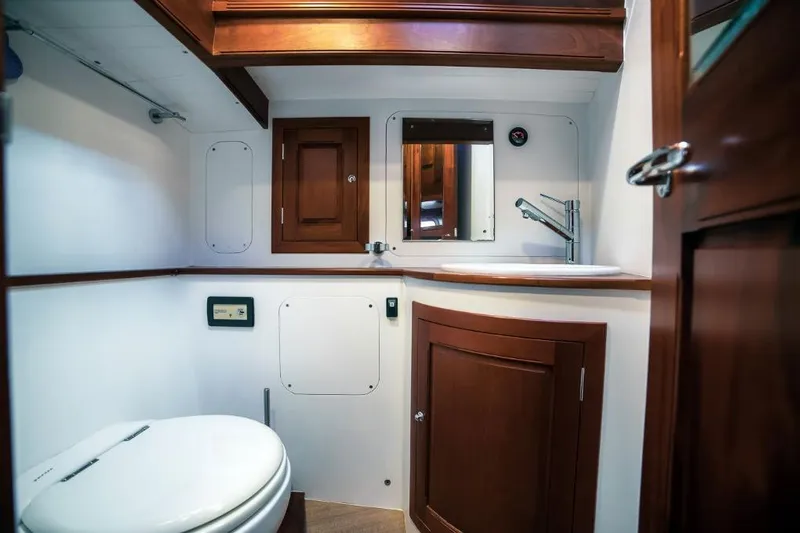 Spirit R74 Yacht Photos Pics Luxurious 2014 Spirit R74 yacht bathroom with wooden cabinetry and modern fixtures.