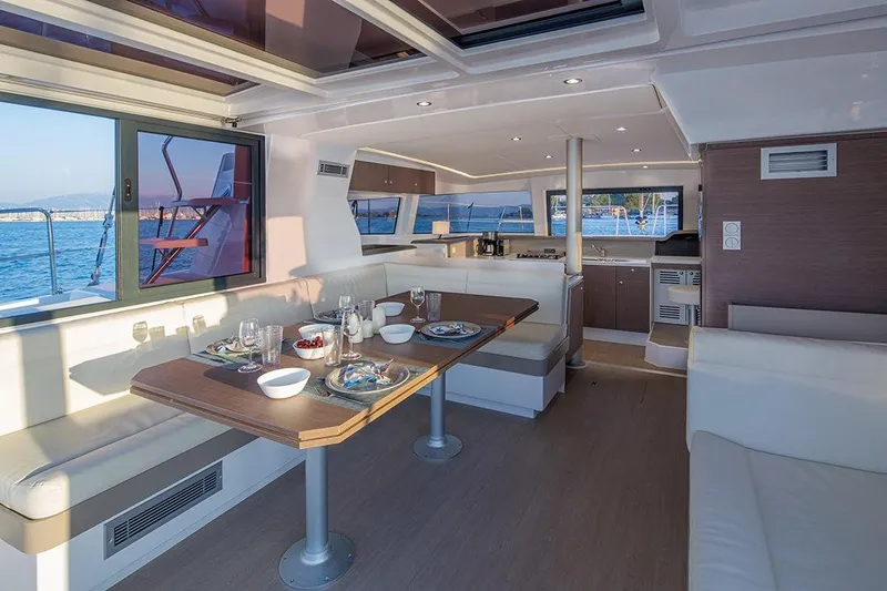  Yacht Photos Pics Modern interior of 2020 Bali 4.1 catamaran with dining area and ocean view.