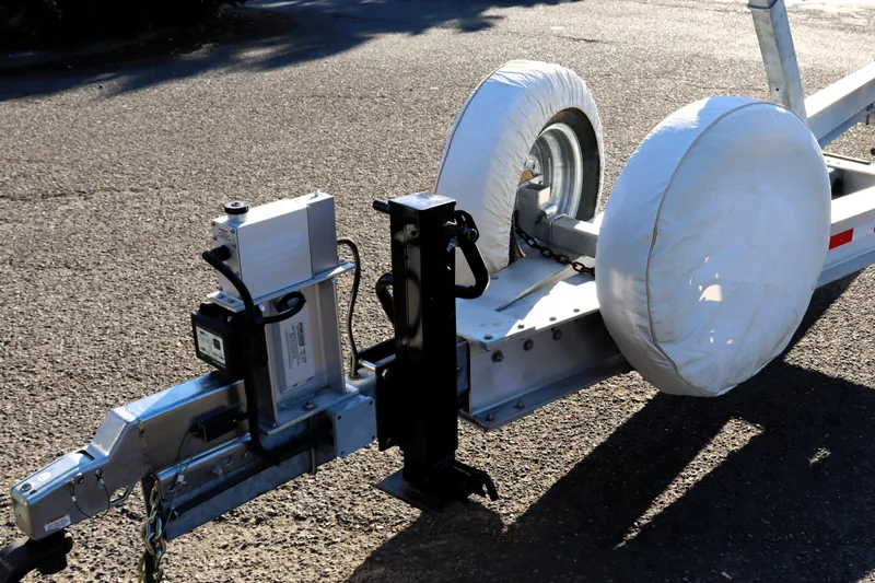 Knot Busy Yacht Photos Pics Trailer hitch and wheels of a 2017 Ranger Tugs R-29 CB boat trailer.