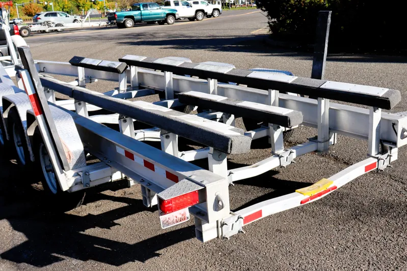 Knot Busy Yacht Photos Pics Boat trailer for 2017 Ranger Tugs R-29 CB, parked in a sunny lot.