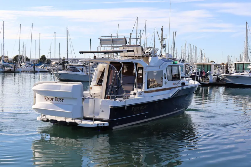 Knot Busy Yacht Photos Pics 2017 Ranger Tugs R-29 CB boat named "Knot Busy" docked in a marina.