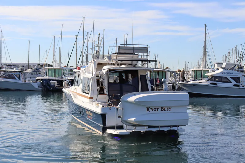 Knot Busy Yacht Photos Pics 2017 Ranger Tugs R-29 CB boat named "Knot Busy" in a marina setting.