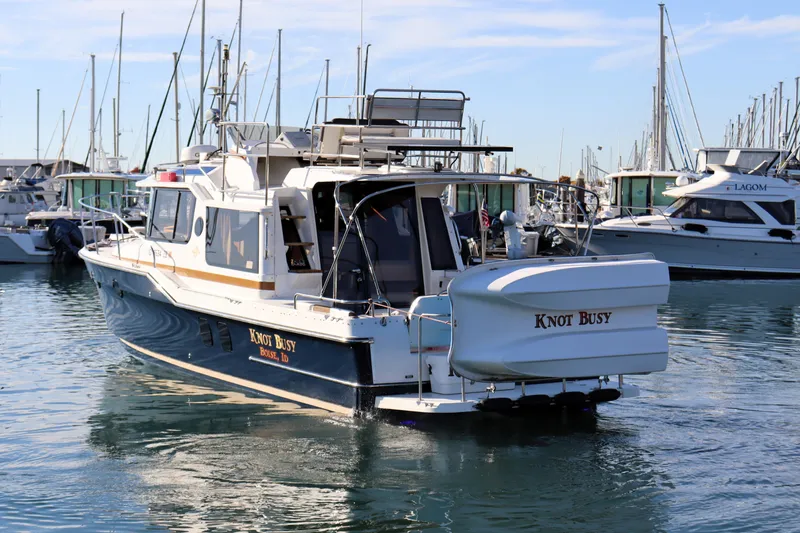 Knot Busy Yacht Photos Pics 2017 Ranger Tugs R-29 CB boat named "Knot Busy" docked in a marina.