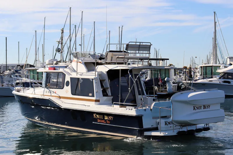 Knot Busy Yacht Photos Pics 2017 Ranger Tugs R-29 CB boat named "Knot Busy" docked in a marina.