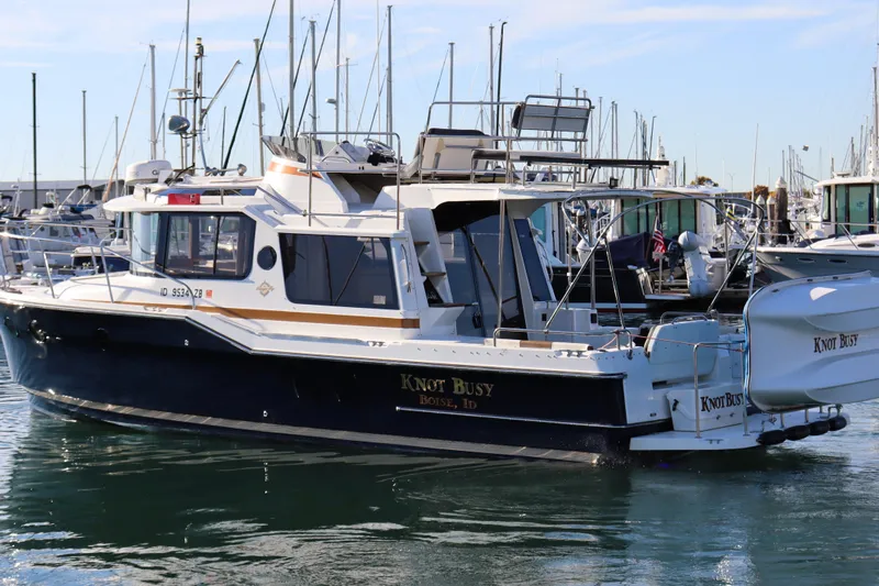 Knot Busy Yacht Photos Pics 2017 Ranger Tugs R-29 CB boat named "Knot Busy" docked in a marina.