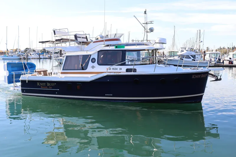Knot Busy Yacht Photos Pics 2017 Ranger Tugs R-29 CB boat named "Knot Busy" docked in a marina.