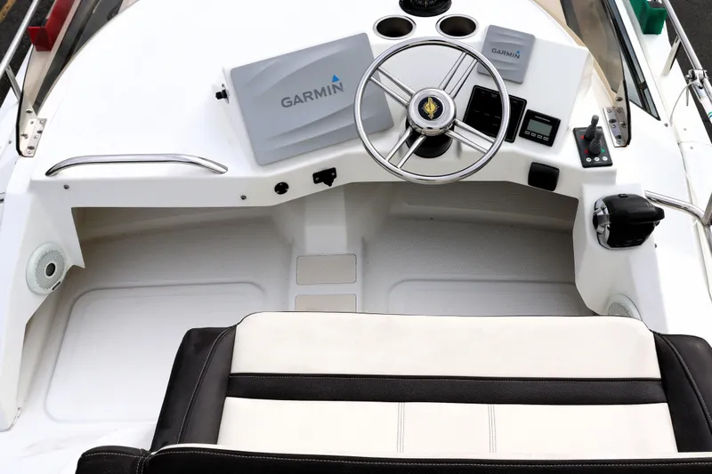 Knot Busy Yacht Photos Pics 2017 Ranger Tugs R-29 CB helm with Garmin navigation system and steering wheel.