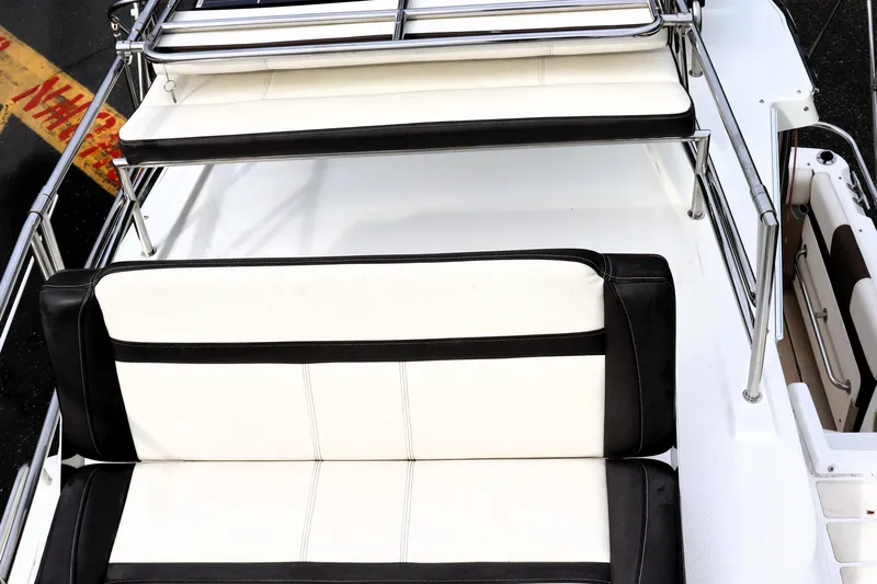 Knot Busy Yacht Photos Pics 2017 Ranger Tugs R-29 CB boat seating with white and black cushions.