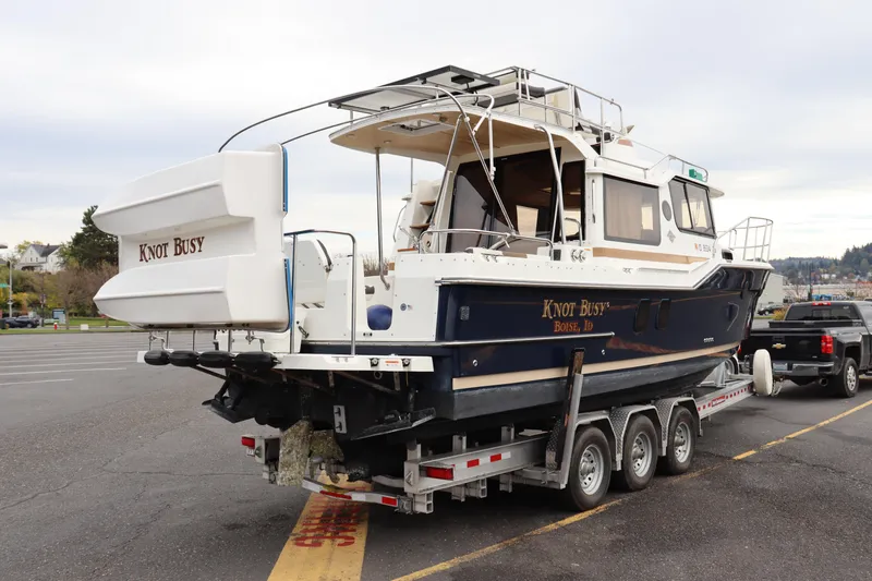 Knot Busy Yacht Photos Pics 2017 Ranger Tugs R-29 CB boat "Knot Busy" on trailer in parking lot.