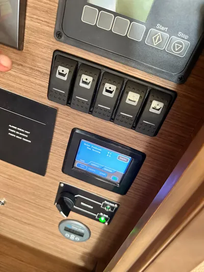 Topdog Yacht Photos Pics Control panel of a 2018 Lagoon 560 S2 yacht with digital display and switches.