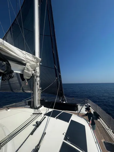 Topdog Yacht Photos Pics Sailing on a 2018 Lagoon 560 S2 catamaran under clear blue skies.