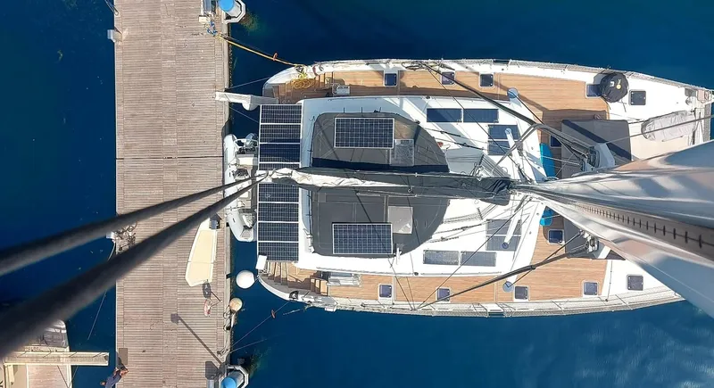 Topdog Yacht Photos Pics Overhead view of 2018 Lagoon 560 S2 yacht docked at a marina.
