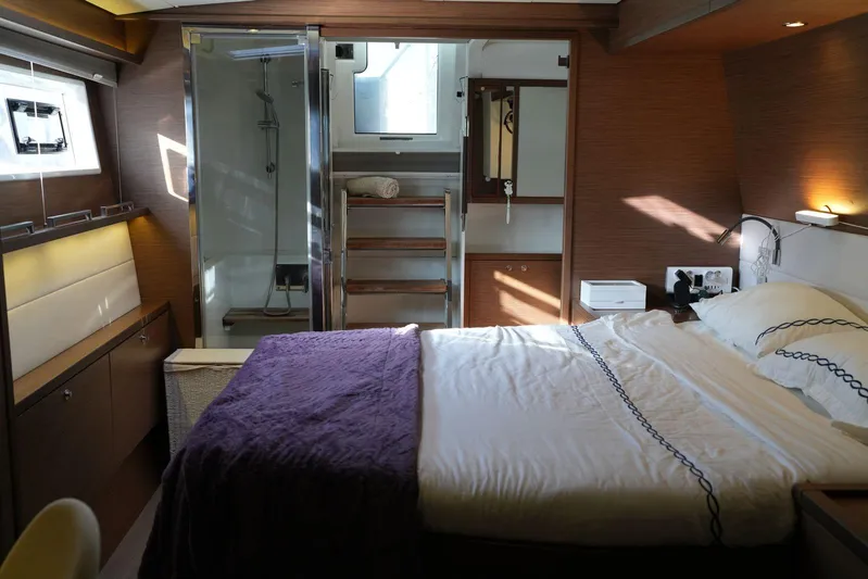 Topdog Yacht Photos Pics Luxurious bedroom interior of 2018 Lagoon 560 S2 yacht with modern amenities.