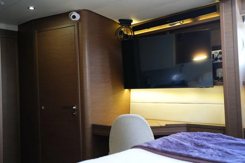 Topdog Yacht Photos Pics Luxurious interior of 2018 Lagoon 560 S2 yacht with modern TV and elegant furnishings.