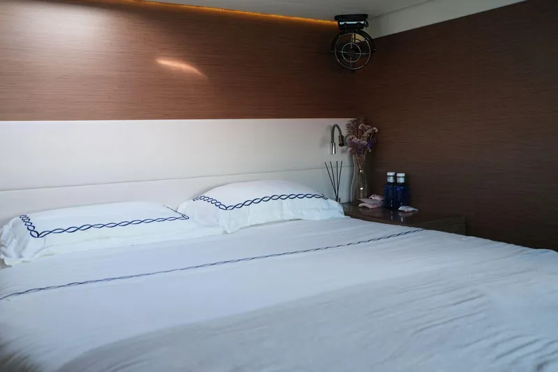 Topdog Yacht Photos Pics Luxurious bedroom interior of 2018 Lagoon 560 S2 yacht with elegant bedding and decor.