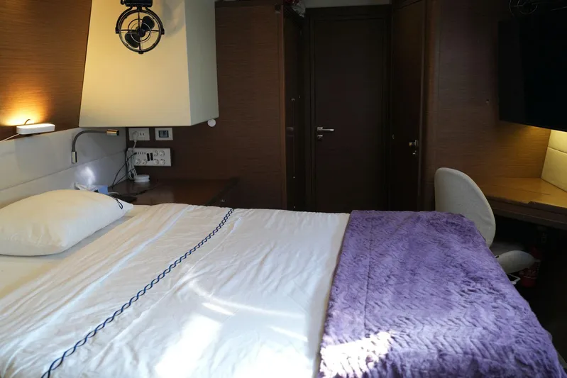 Topdog Yacht Photos Pics Luxurious cabin interior of 2018 Lagoon 560 S2 yacht with cozy bed and modern amenities.