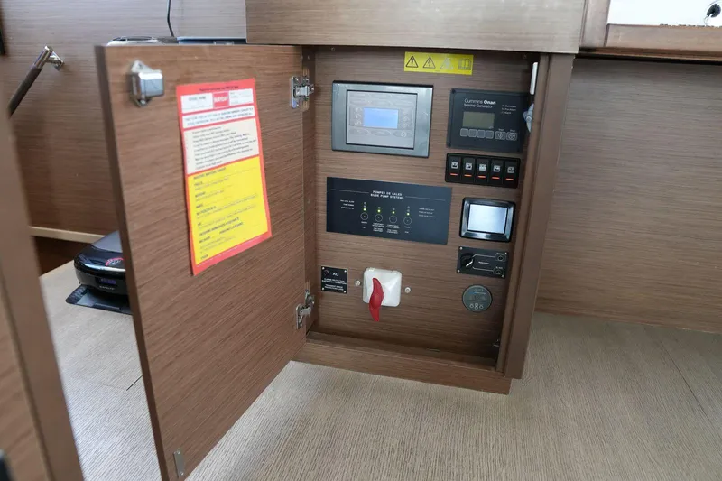 Topdog Yacht Photos Pics Control panel inside a 2018 Lagoon 560 S2 yacht, featuring various switches and displays.