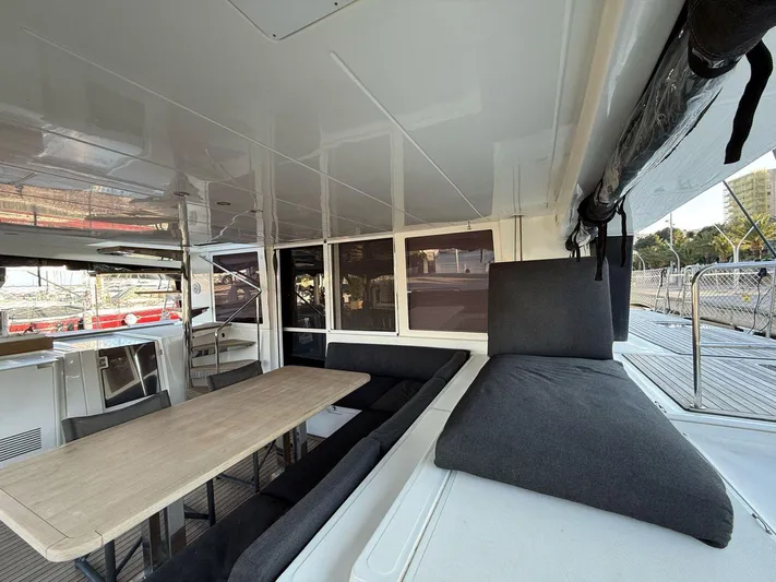Topdog Yacht Photos Pics Spacious interior of 2018 Lagoon 560 S2 yacht with dining area and seating.