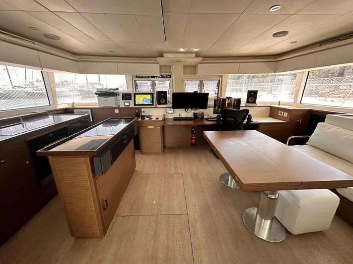 Topdog Yacht Photos Pics Interior of 2018 Lagoon 560 S2 yacht with modern navigation and seating area.