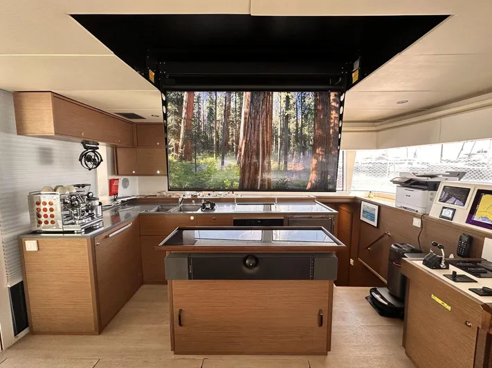 Topdog Yacht Photos Pics Modern kitchen interior on 2018 Lagoon 560 S2 yacht with forest view screen.