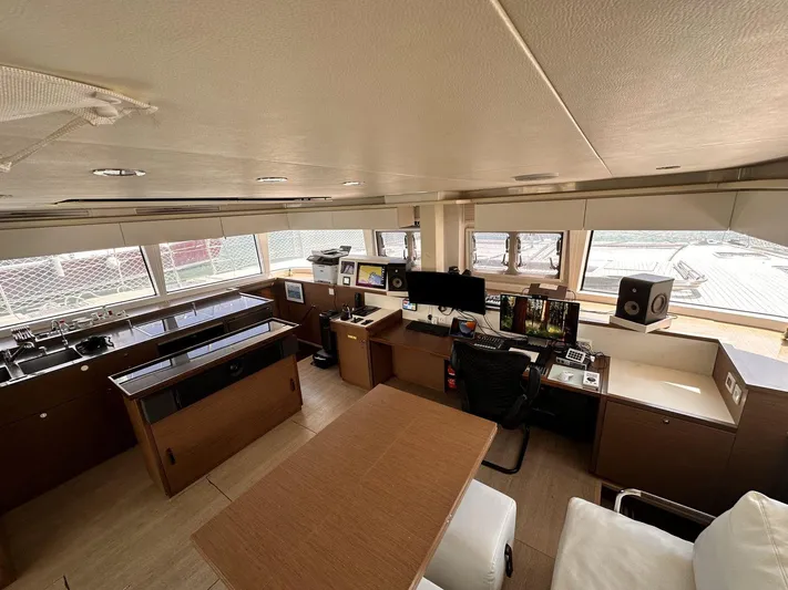 Topdog Yacht Photos Pics Luxurious interior of 2018 Lagoon 560 S2 yacht with modern navigation equipment.