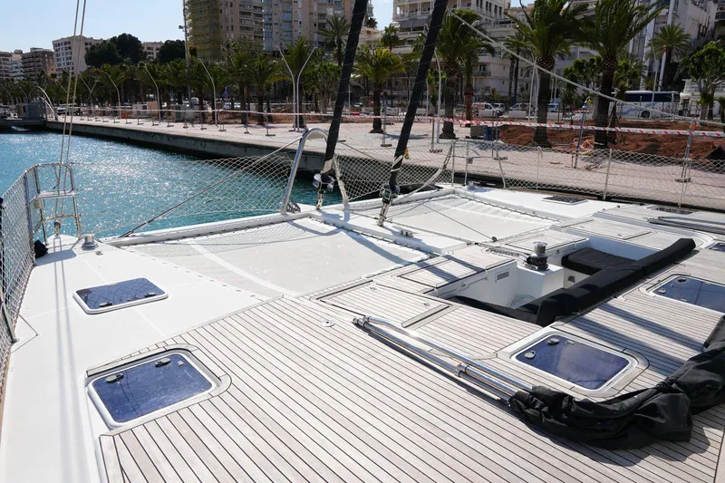 Topdog Yacht Photos Pics 2018 Lagoon 560 S2 yacht deck with cityscape and waterfront view.