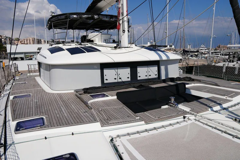 Topdog Yacht Photos Pics 2018 Lagoon 560 S2 yacht with spacious deck and modern design in marina setting.