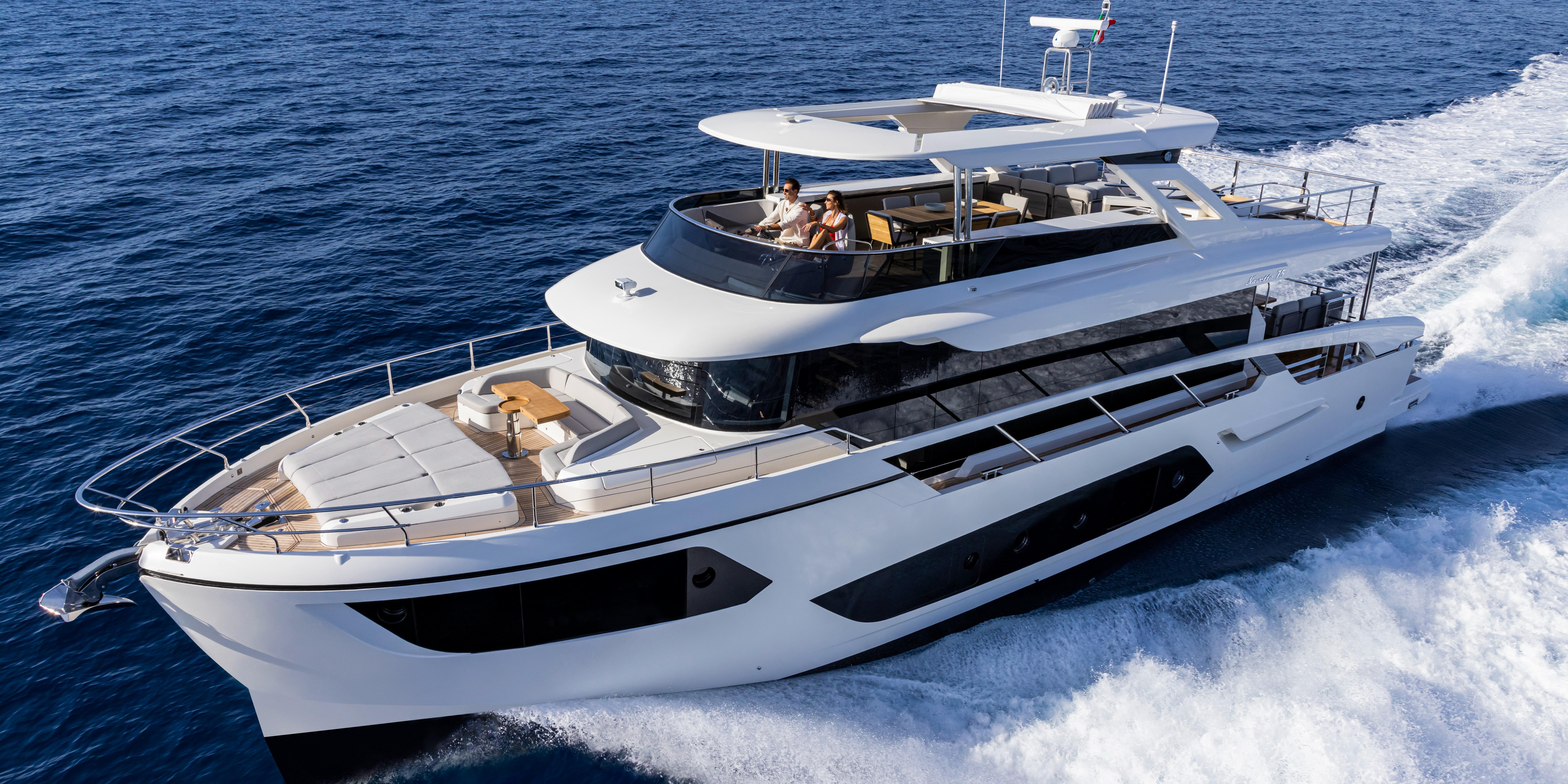 Luxurious 2025 Absolute NAVETTA 75 yacht cruising on open sea.
