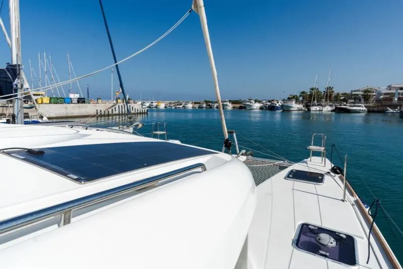  Yacht Photos Pics 2020 Lagoon 40 catamaran docked in a sunny marina with clear blue skies.