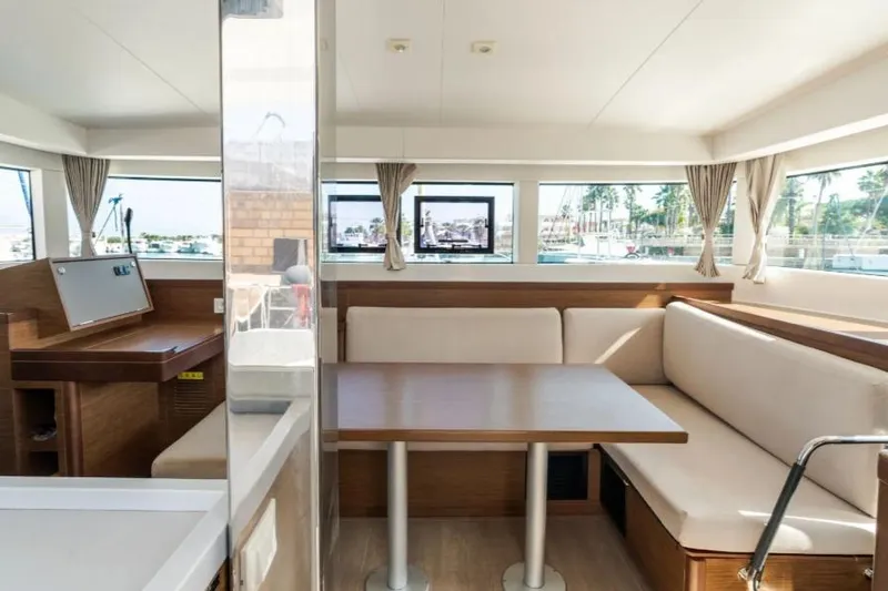  Yacht Photos Pics Interior of 2020 Lagoon 40 catamaran with modern seating and large windows.