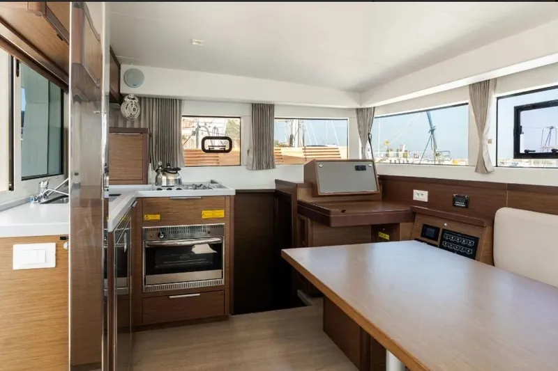  Yacht Photos Pics Interior of 2020 Lagoon 40 catamaran featuring modern kitchen and dining area.