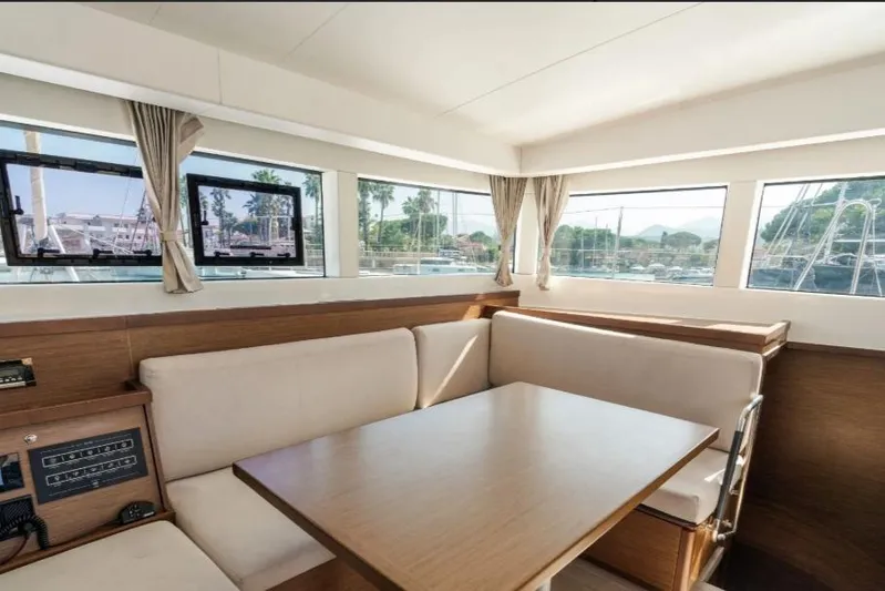  Yacht Photos Pics Interior of 2020 Lagoon 40 catamaran with spacious seating and large windows.