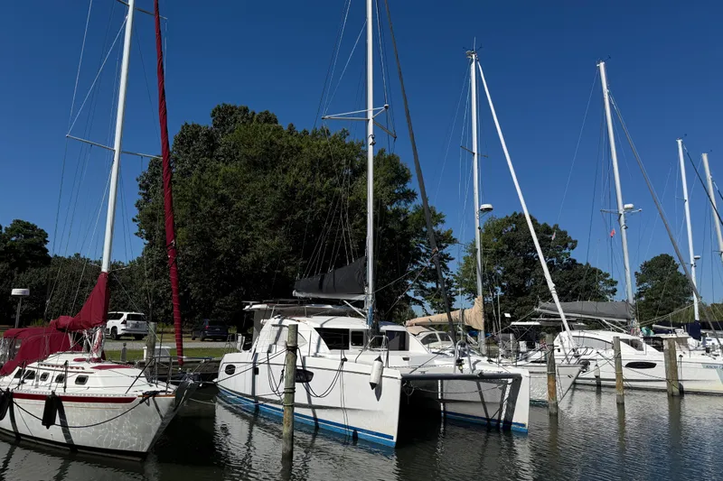 Selah Yacht Photos Pics Sailboats docked at a marina, featuring a 2010 Leopard 38 catamaran.