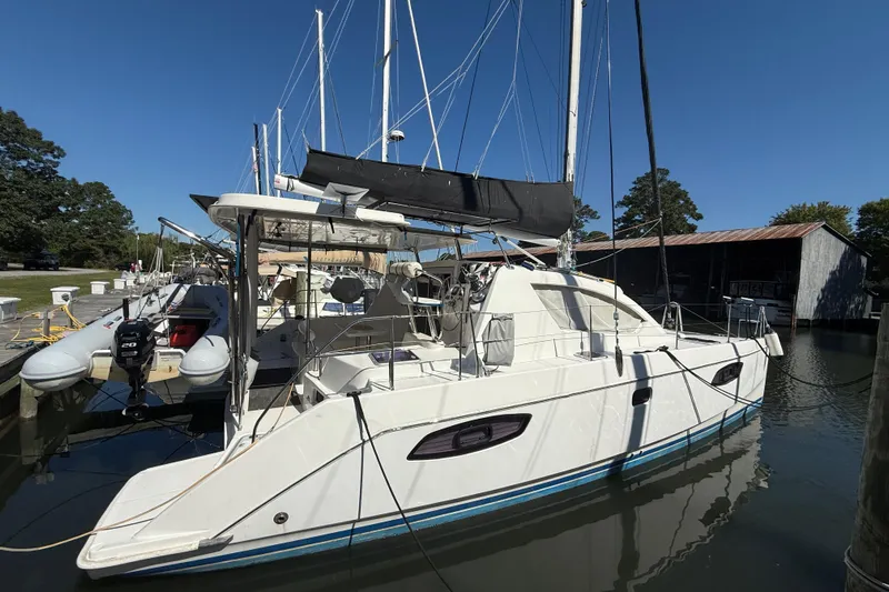 Selah Yacht Photos Pics 2010 Leopard 38 catamaran docked at marina under clear blue sky.